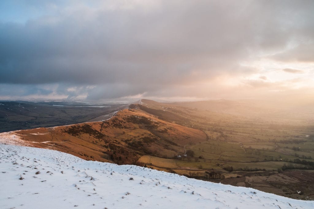 The Great Ridge in winter at sunrise with intense light and snow from just below the summit of Mam Tor - Mam Tor Photography Location Guide.jpg